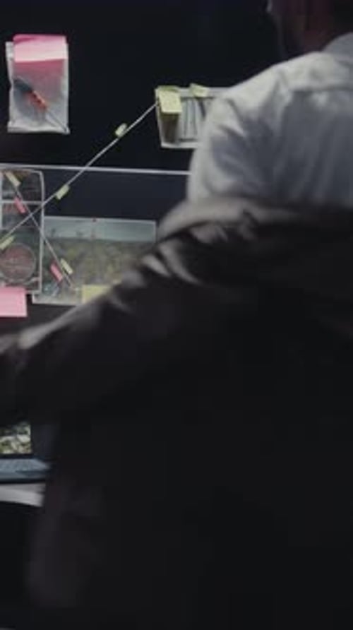 Detective Arrives at Dark Urban Office Workplace