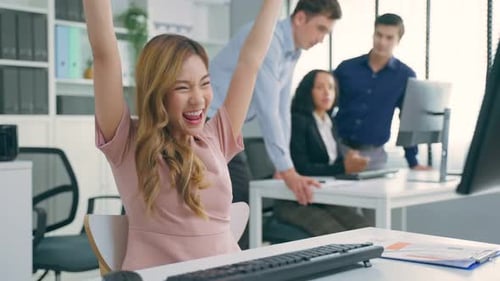 Asian beautiful business woman smile feel happy while work in office.