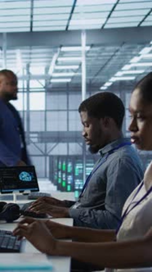 Vertical Video Data Center Engineers Maintaining Company Network Infrastructure