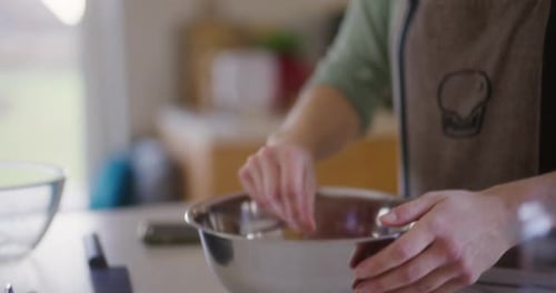 Woman Working in Kitchen Preparing Bread Dough