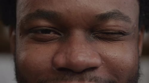 Man Wink in Extreme Close Up