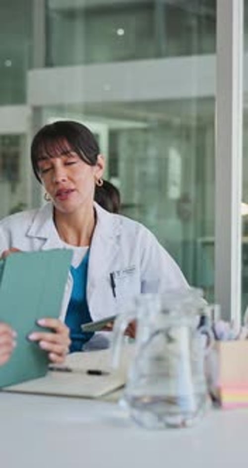 Medical Professionals Discussing Patient Care in Modern Office