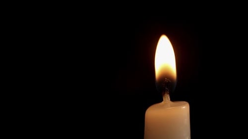 Close Up of Candle Flame in Darkness