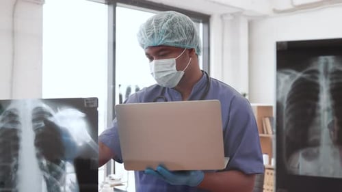 Medical Professional Examining Chest X-Ray