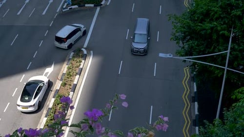 Slow motion landscape view of cars turning at intersection crossroad of freeway highway busy road in