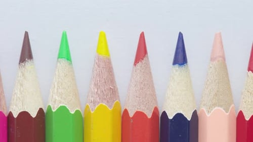 Row of sharpened colored pencils ready for drawing