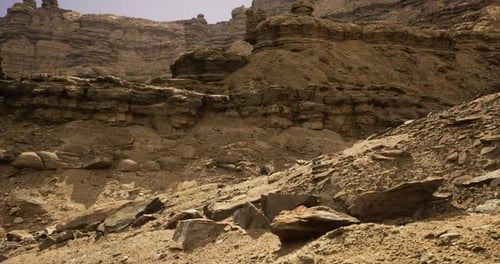 Desert Landscape with Rocky Formations Under a Clear Sky at Midday
