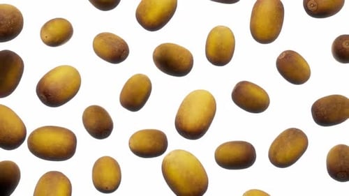 Golden Kiwi Fruits Falling on Clean White Background