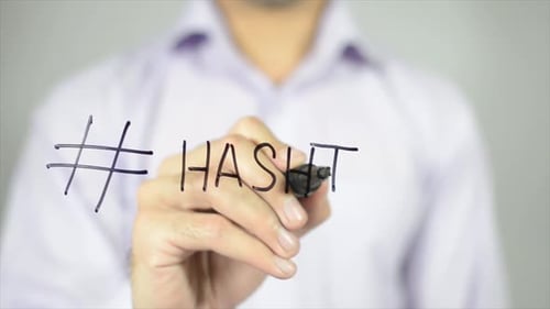 Hand Writing Hashtag On Glass