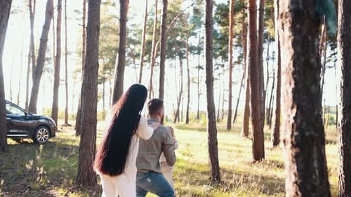 Happy Family Bonding in Forest on Sunny Day