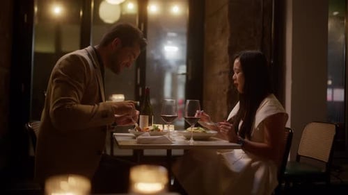 Couple's Intimate Dinner At A Restaurant