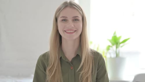 Blonde Woman Smiling at Camera