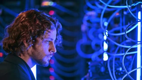 Man analysing servers in a data center