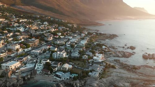 Landscape Of A Coastal City At Camps Bay, Cape Town, South Africa - aerial drone shot