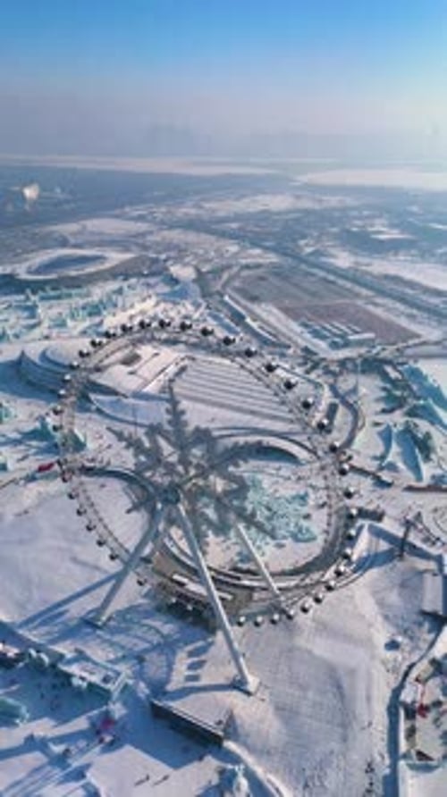 Aerial View of a Snow Covered Ferris Wheel