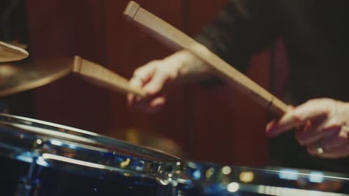 Drummer Showcases Rhythm Skills in Intimate Music Setting