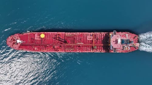 Crude oil tanker navigating open waters amidst global energy demand