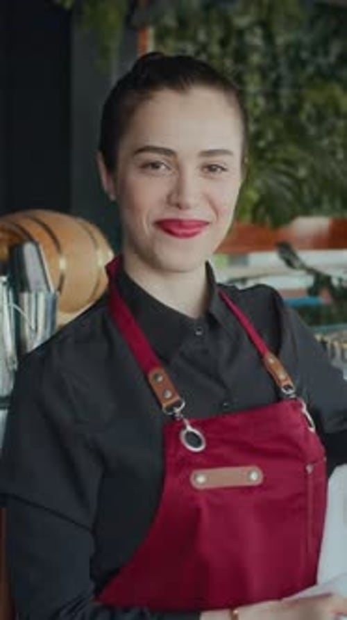 Waitress Posing at Camera near Bar Counter