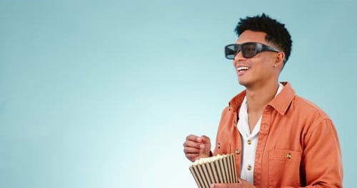 3d, glasses and man with popcorn in cinema theatre for movie, film or comedy show in studio