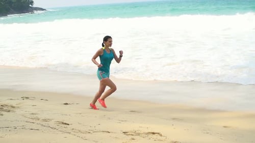 Young Woman Jogging on Beach Near Sea, Super 240