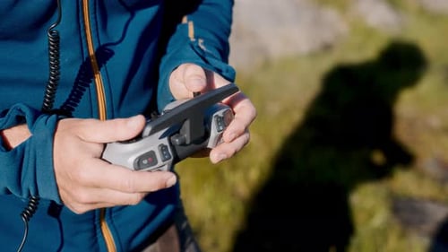 Skilled Hands Directing Drone Flight With Precision