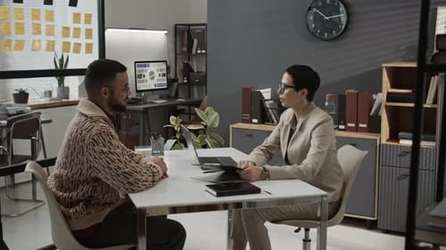 Business Meeting at Desk with Man and Woman
