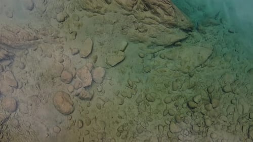 This Aerial View Captures a Tranquil Water Surface Perfect for Relaxation and Meditation