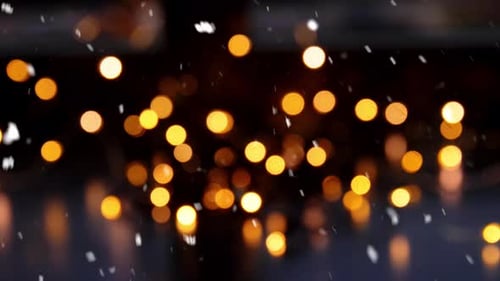 Snow Falling Over Bokeh Lights At Night