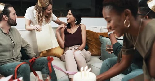 Friends Celebrating a Birthday with Cake and Gifts