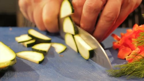 Slicing Zucchini on a Cutting Board
