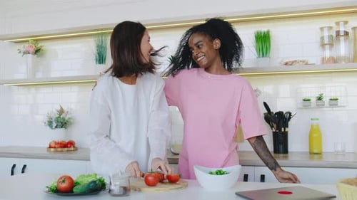 Two Women Cooking and Dancing in Kitchen