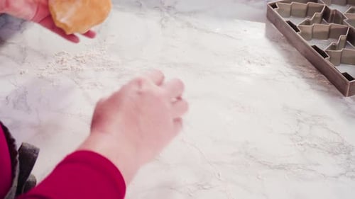 Person Rolling Dough for Christmas Cookies