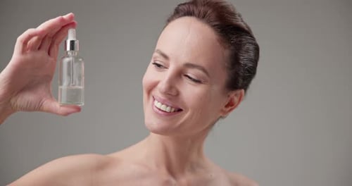 Woman Poses with Beauty Product Close-Up