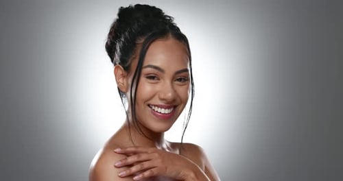 Face, skincare and hands of happy woman in studio isolated on a gray background mockup space