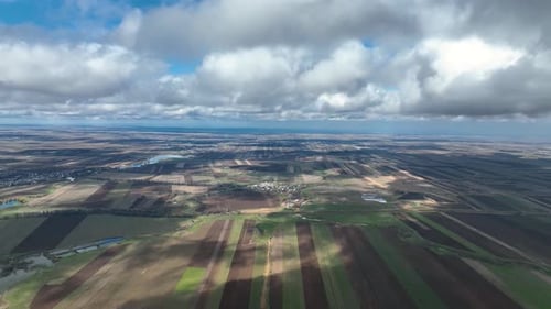 Farmland Aerial View with Dramatic Clouds in Daytime