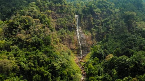 Aerial view of Diamante Waterfall cascading through lush jungle in Costa Rica