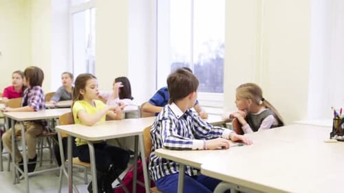 Elementary school students learning together in a bright classroom environment