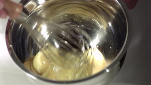 Egg Whisking in a Bowl for Cooking Food