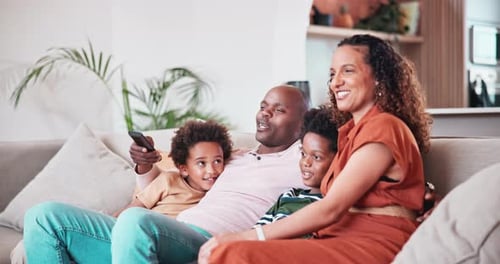 Happy Family Relaxing on Couch Together