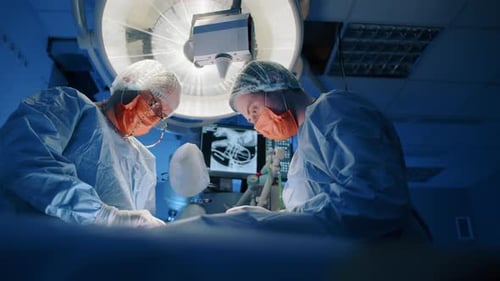 Medical Team Performing Surgery in Operating Room
