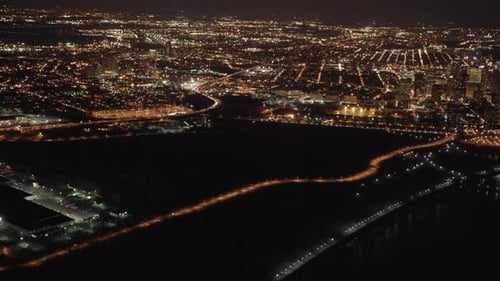 Aerial view of illuminated highway traffic road at night. cars driving freeway