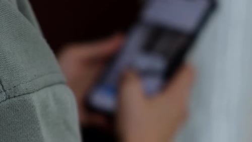 Hand Holds and Scrolls on Phone