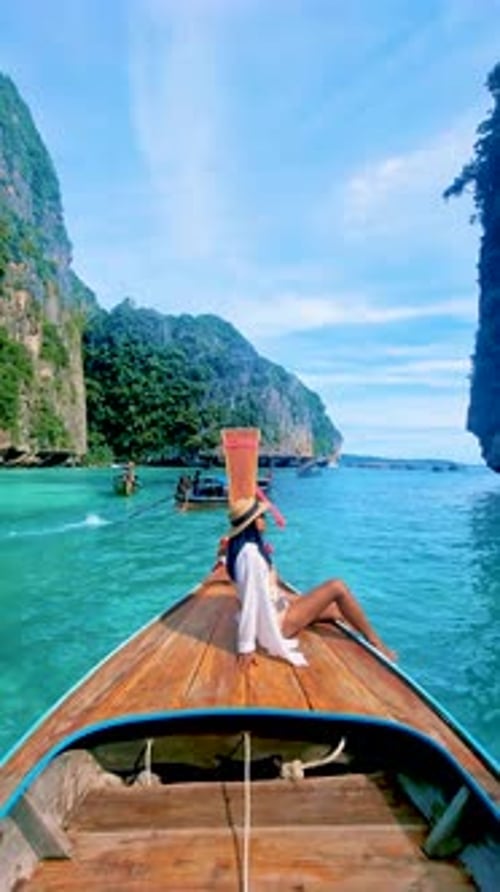 Pileh Lagoon with Green Emerald Ocean at Koh Phi Phi Thailand Women in Front of Longtail Boat