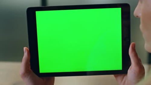 Woman Holding Tablet With Green Screen for Chroma Key