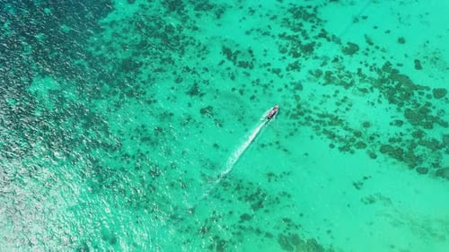 Aerial view of iconic tropical turquoise water Pileh Lagoon surrounded by limestone cliffs, Phi Phi