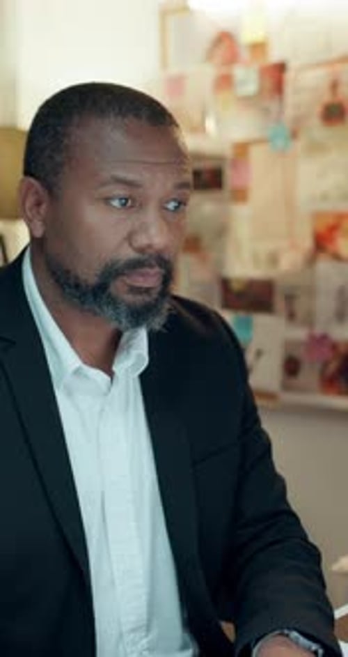 Thinking, black man and detective typing in office for research, investigation and problem solving