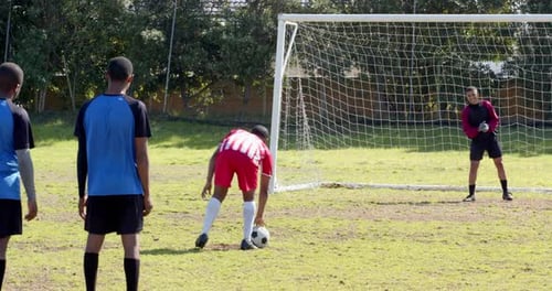 Youth Soccer Team Practicing on a Green Field