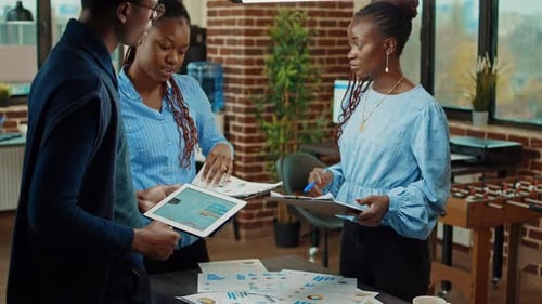 Company Workers Reviewing Documents