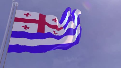 Waving Flag of Adjara Against Blue Sky