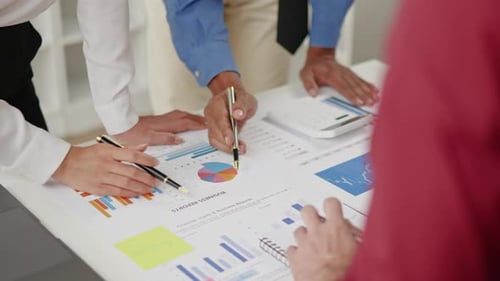 Close up of hands are working and brainstorming on paperwork about business financial and marketing.